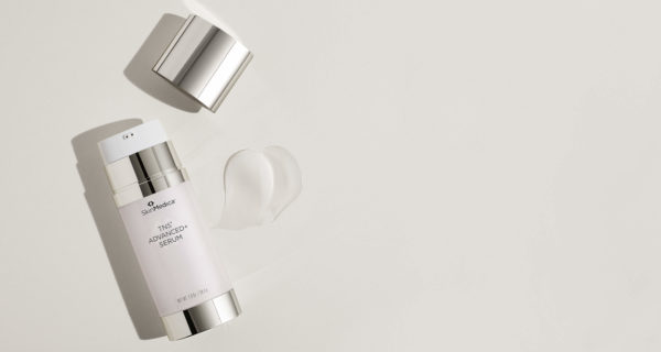 SkinMedica TNS Advanced+ Serum product bottle with product smear